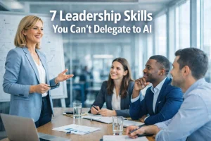 A businesswoman presents to three colleagues in a meeting room, smiling and engaging with them. Text reads: 7 Leadership Skills You Can't Delegate to AI.